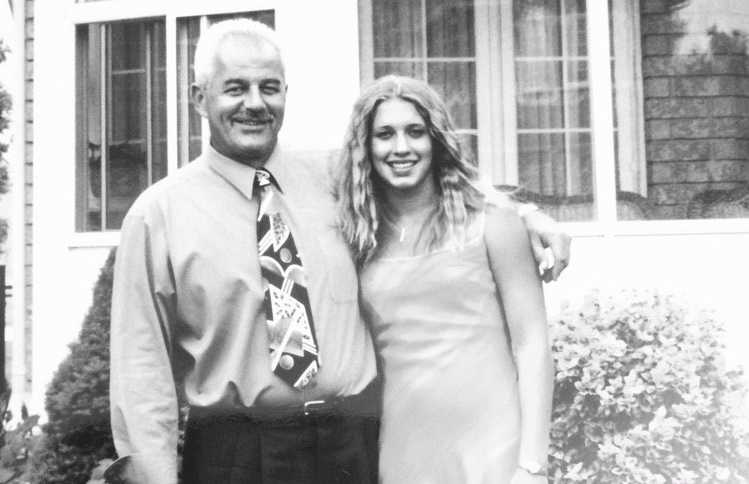 deceased father with arm around his daughter in black and white