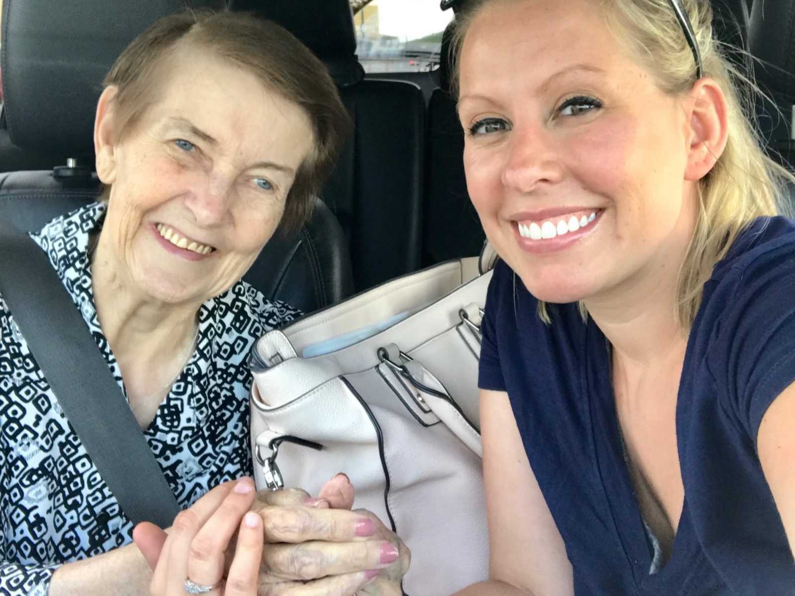 granddaughter takes smiling selfie in car with grandmother who had alzheimers