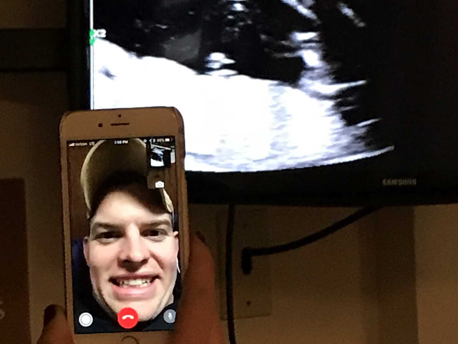 iphone on facetime with the soldier with the ultrasound in the background