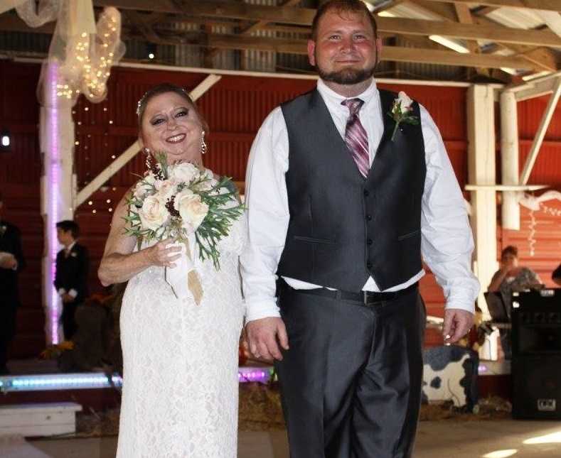 disabled couple smiling at their wedding ceremony 