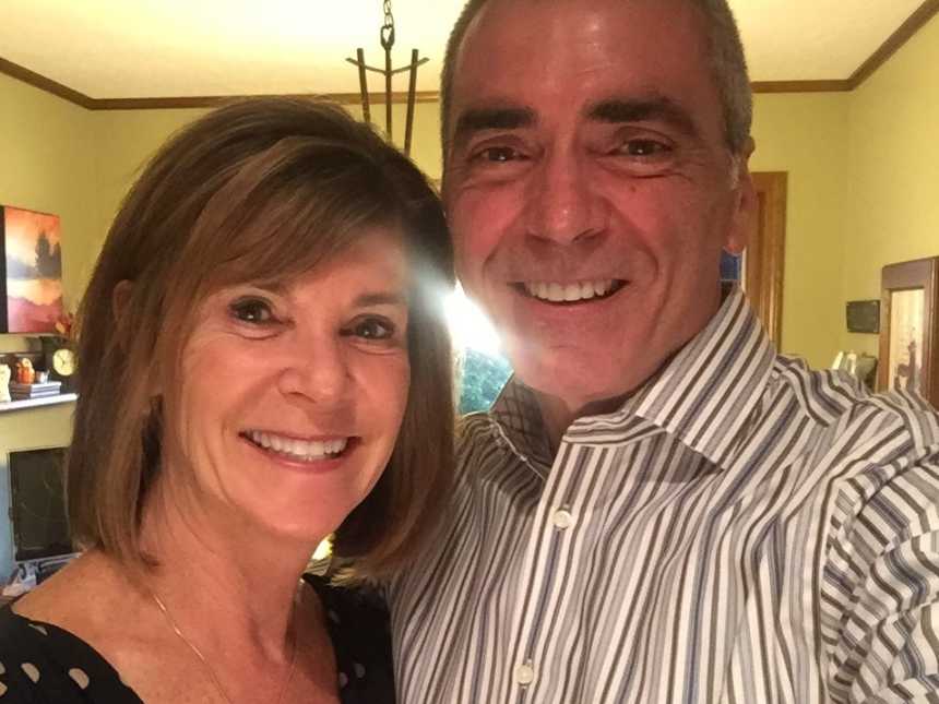couple takes selfie of them smiling