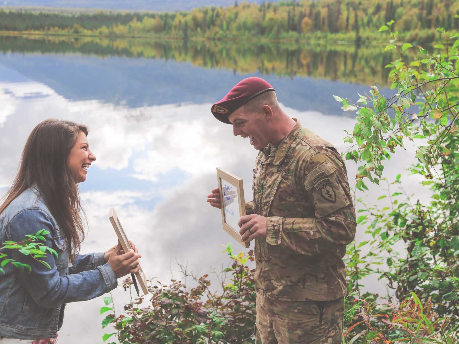 woman and soldier turn to each other and soldier sees in excitement that they are having a baby