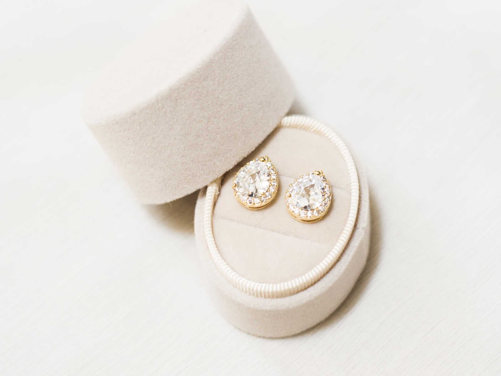 jewelry case opened displaying pear shaped diamond earrings