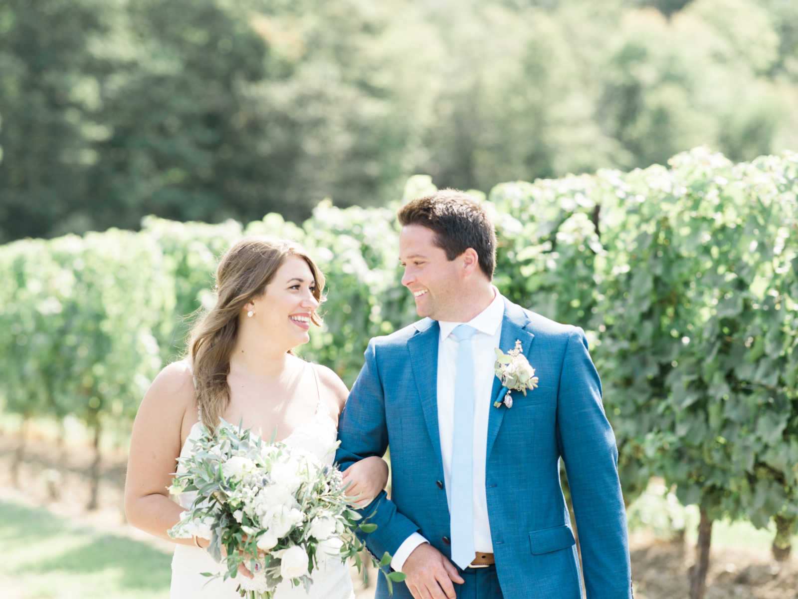 bride and groom smiling at each other ad wedding 