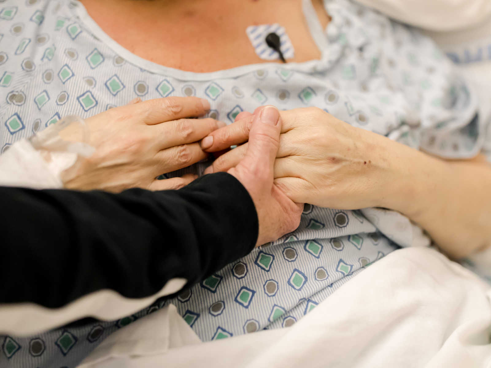 Close up of woman with non-hodgkin's lymphoma hold someones hand
