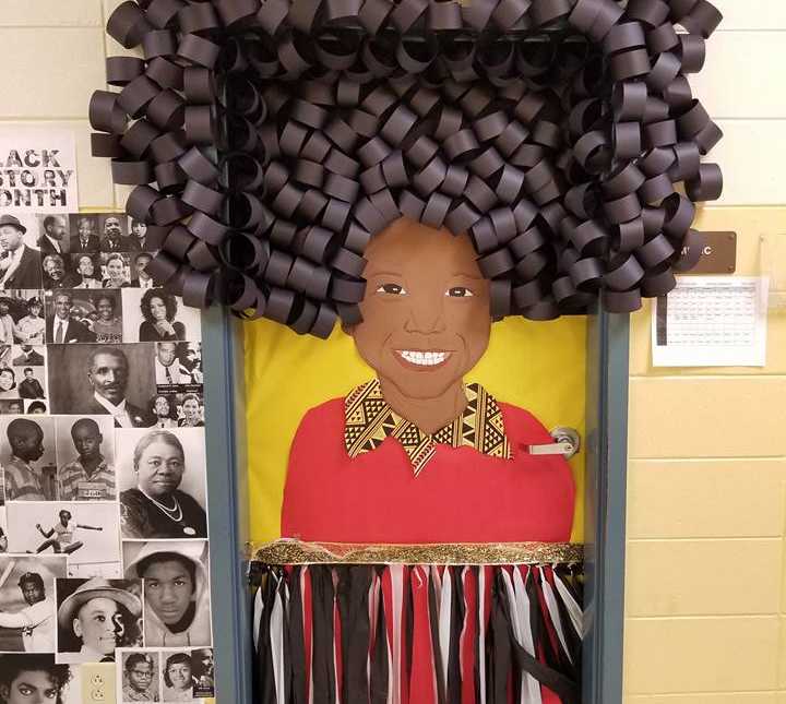 classroom door with African american woman made out of paper next to pictures of notable african americans