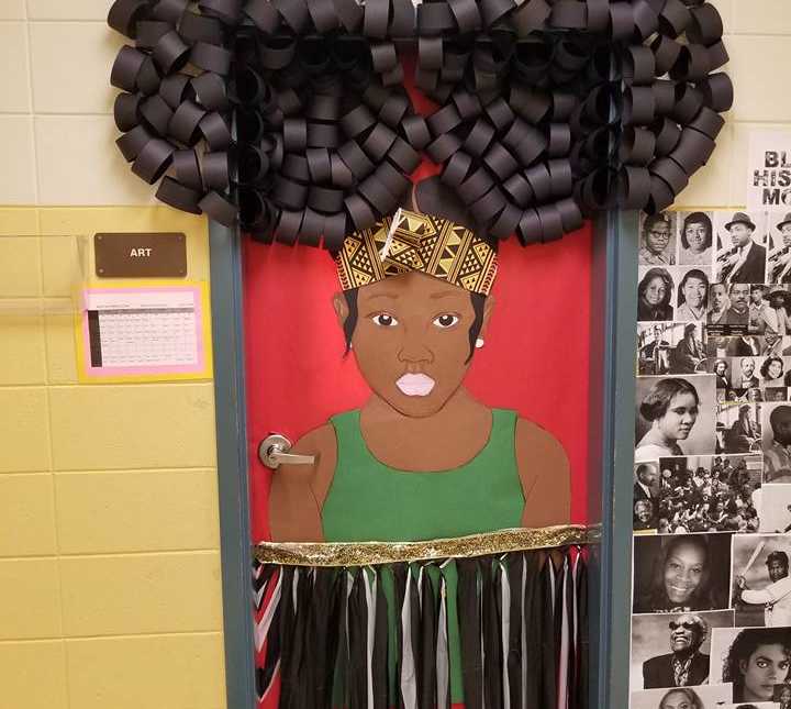classrrom door with african american woman made out of paper covering it