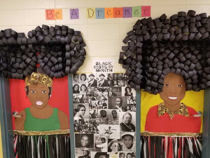 Black history month decorations of woman made of paper on doors, be a dreamer sign, and faces of notable african americans
