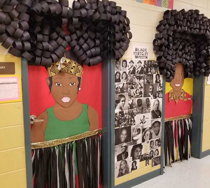 classroom doors decorated with african american women made out of paper with posters of famous african Americans