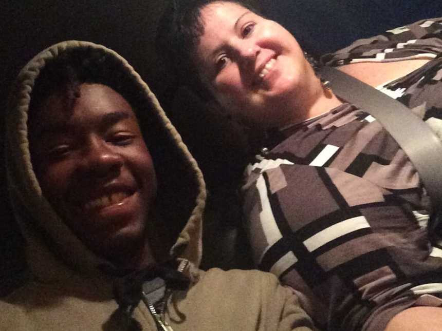 mother and son smile in the car for a selfie