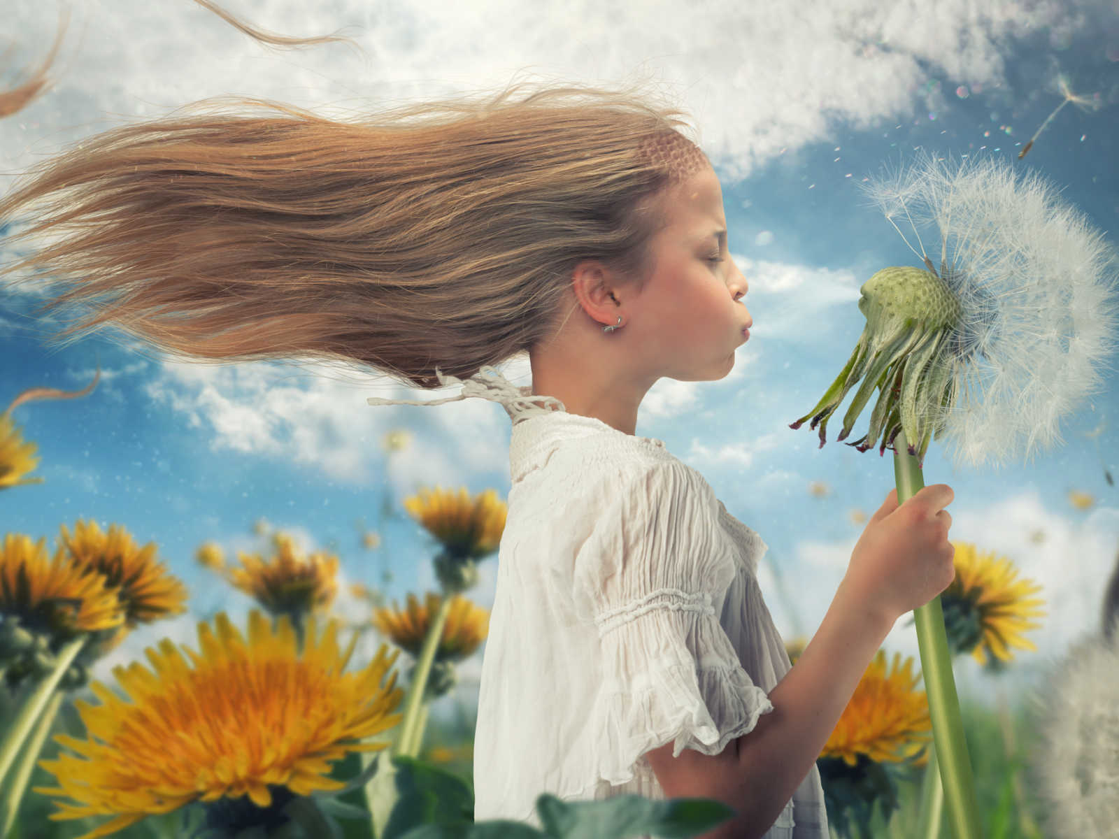 young girl with hair blowing in the wind blows at enlarged animated dandelion