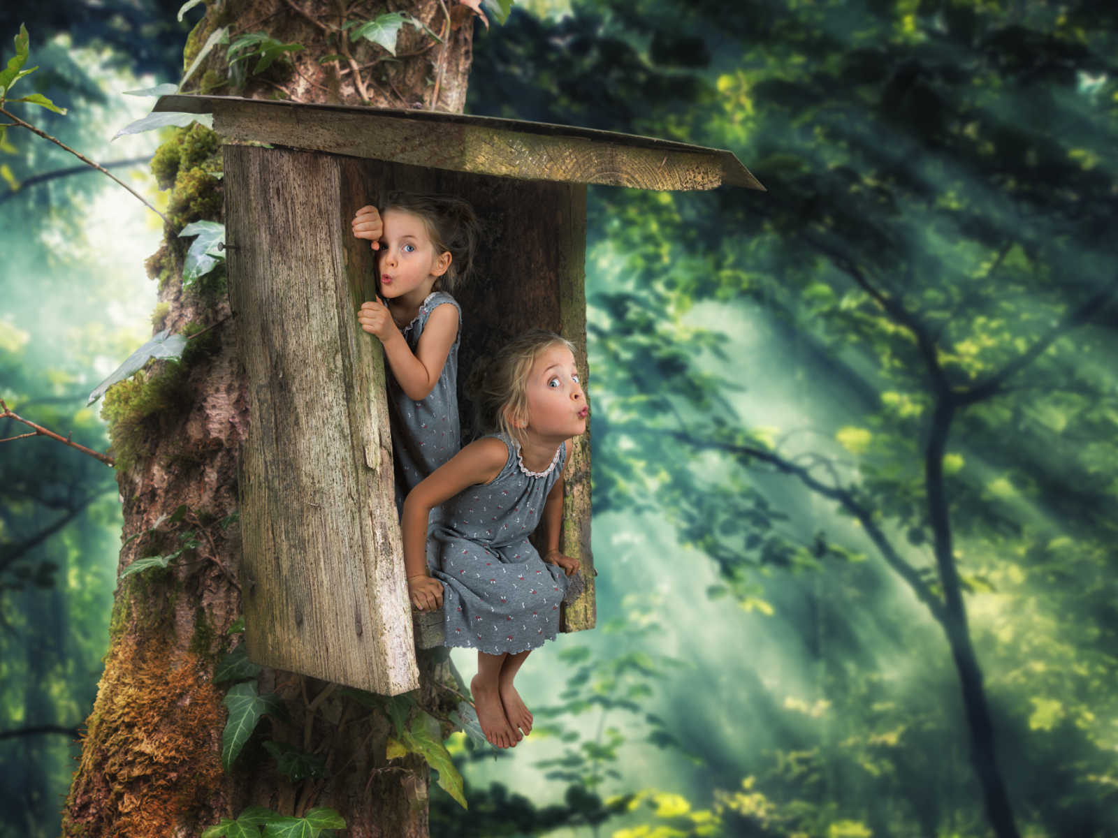 young girls in gray nightgowns sit in wooden structure in animated forest
