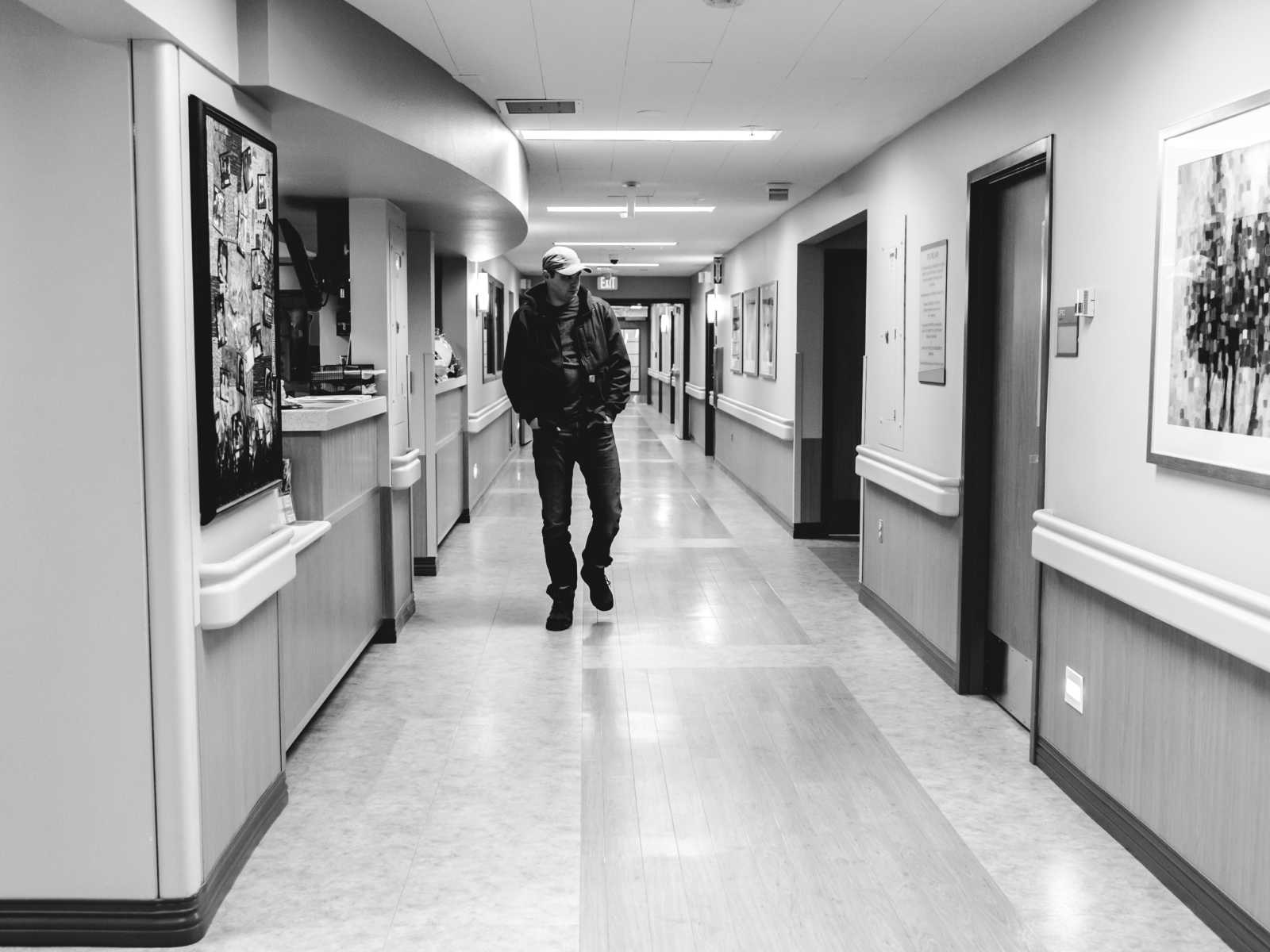 husband walk the hallway of hospital