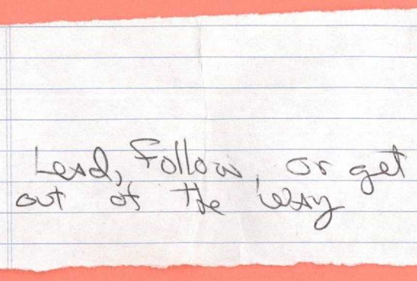 note written on torn notebook paper saying, "lead, follow, or get out of the way"