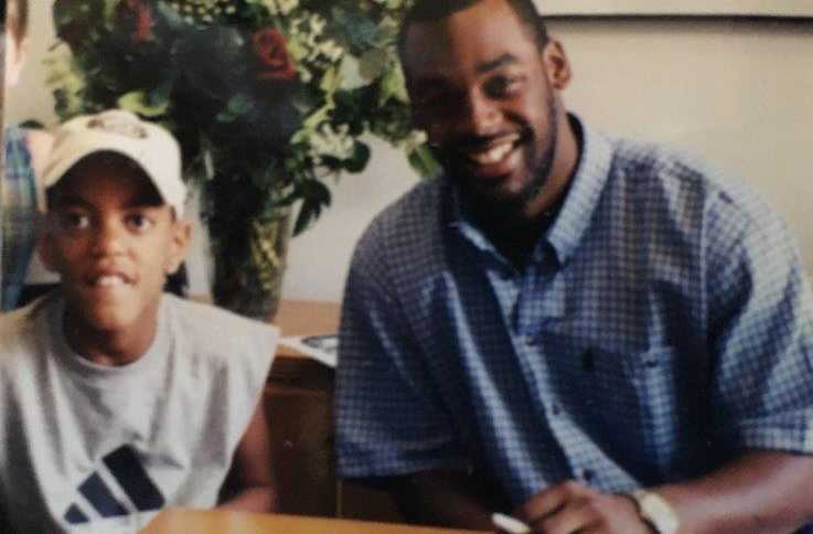 teenage boy and son sitting at a table together