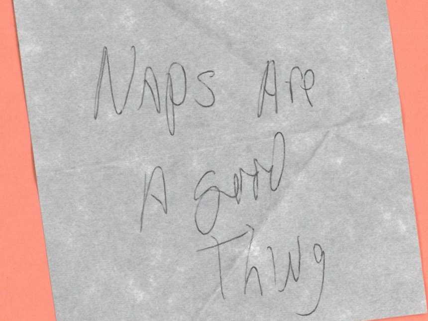 note write on gray paper saying, "naps are a good thing"