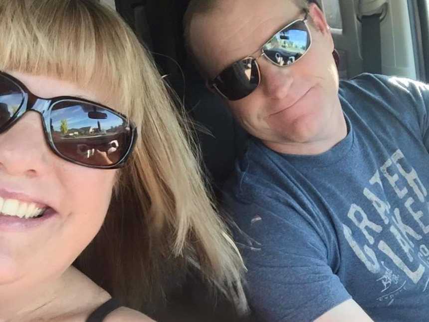 Wife of pancreatic cancer survivor takes selfie of her and her husband in car