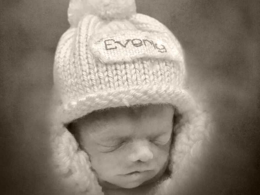 Deceased newborn in knit hat
