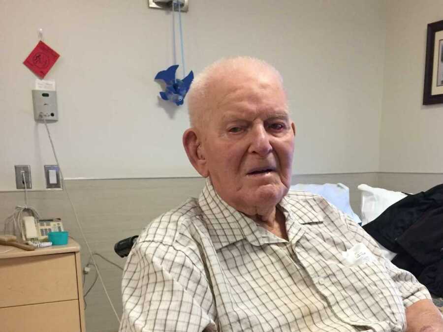 Great grandfather gazes into camera in striped shirt