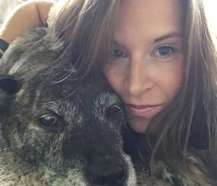 adopted dog and owner are head to head in selfie