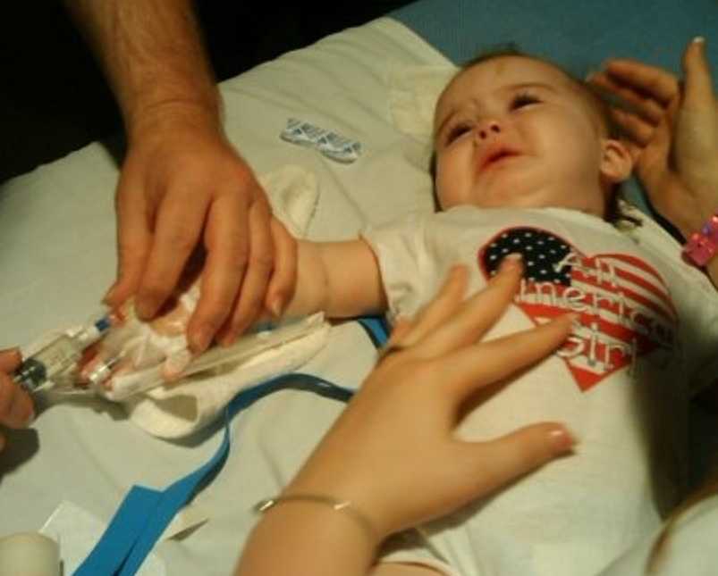 Little girl with rare disease as a baby receiving a shot