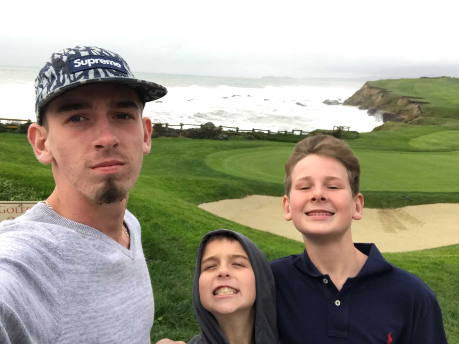 Two brothers who survived Parkand school shooting take selfie with younger brother on golf course