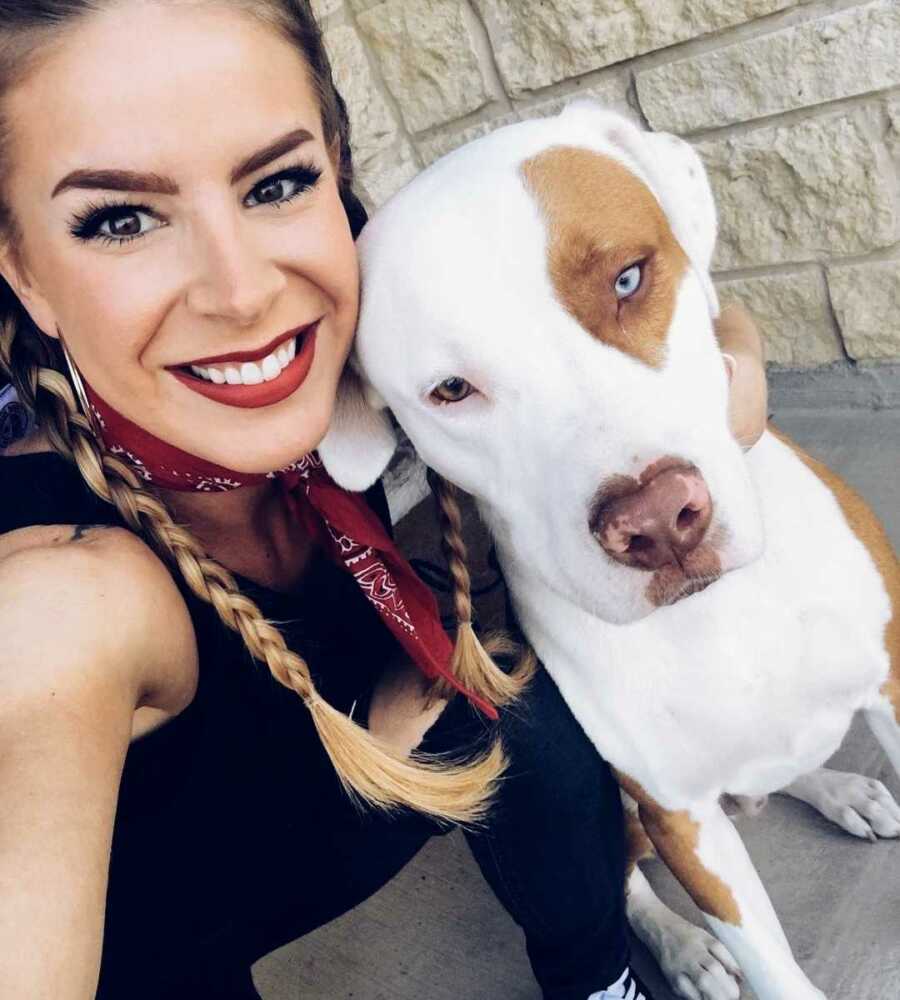 woman takes selfie with dog