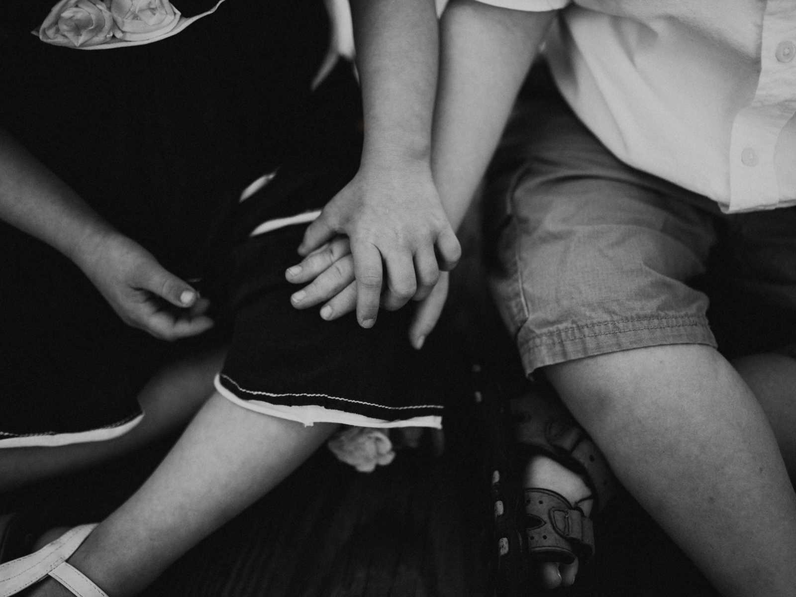 Down syndrome boy and girl holding hands