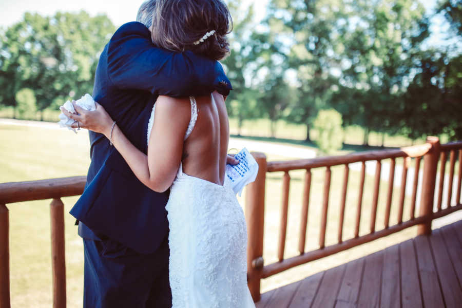 Farmer and father hugs daughter before wedding