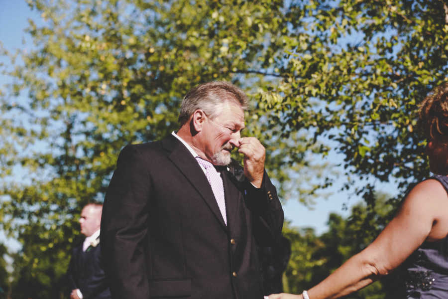 Father of bride cries at wedding