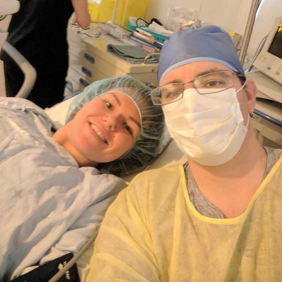 Woman who was scared she'd never be pregnant smiles lying in hospital bed with husband in selfie
