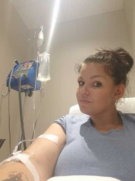 Woman with infertility issues takes selfie in hospital bed