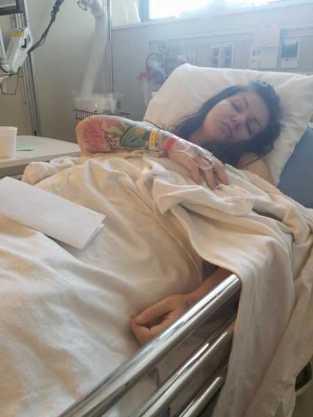 Woman who always wanted to be a mother lying in hospital bed after egg retrieval surgery