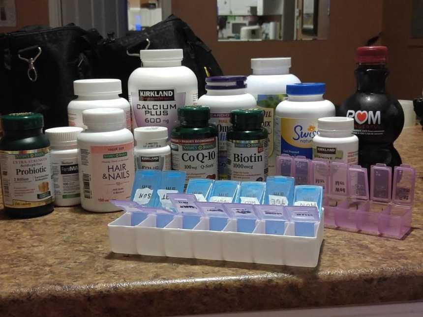 Assortment of pills on counter for woman with fertility problems who wants to have child