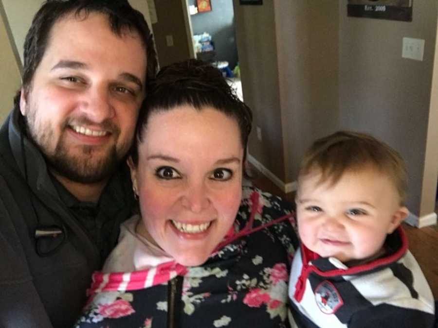 Father and mother who lost over 100 pounds smile with baby son in selfie