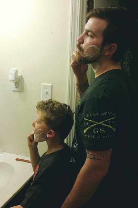 Stepdad shaving with stepson pretending to shave in front of him