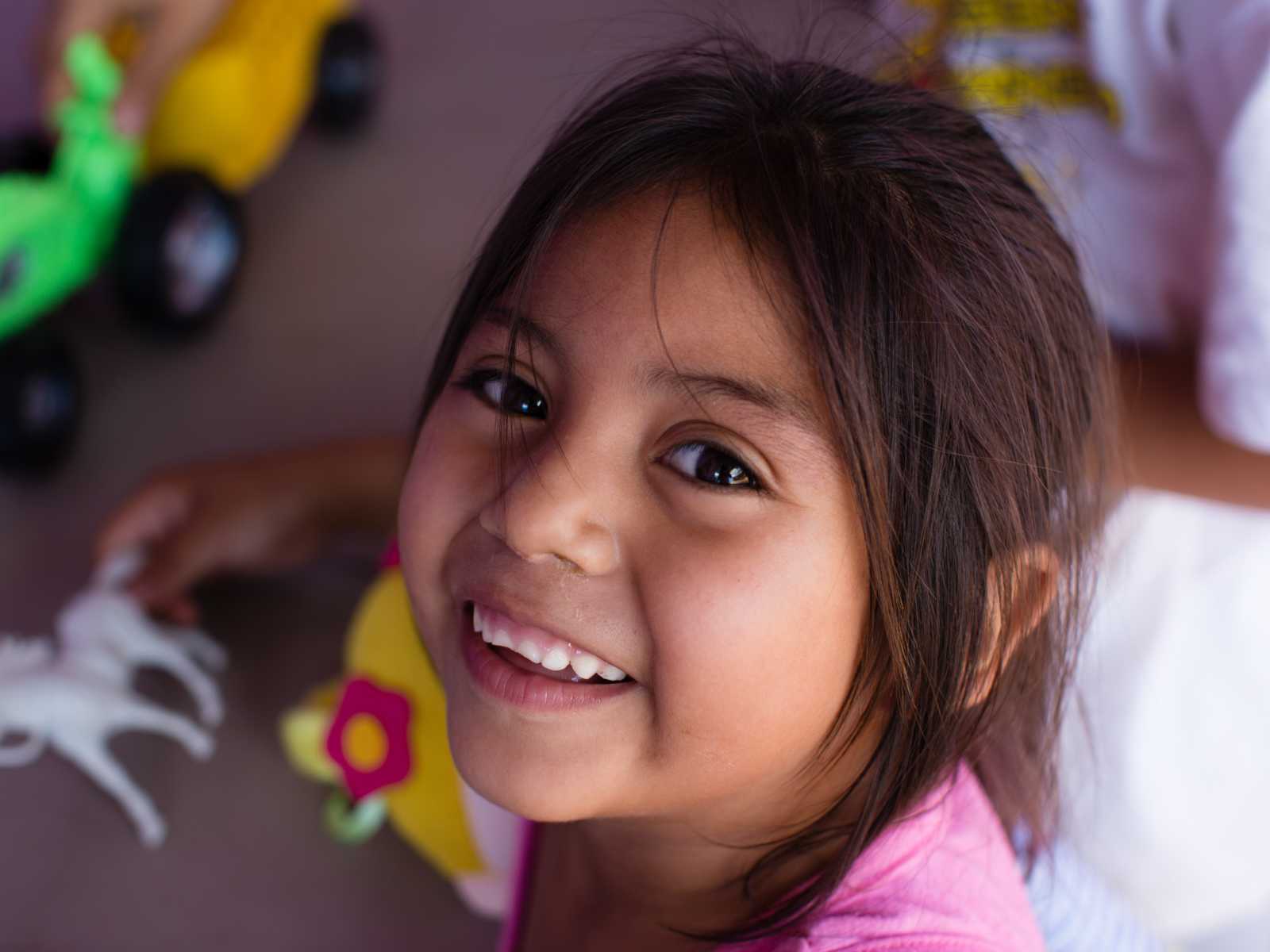 Orphan girl smiling at orphanage in Mexico