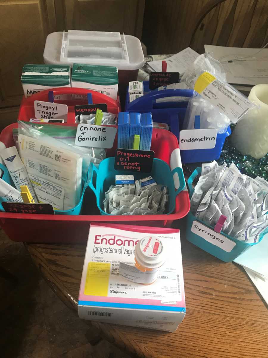 Fertility medicine spread out and labeled on table