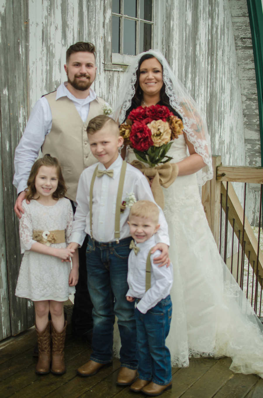 Bride and mother stand with her three kids and new husband