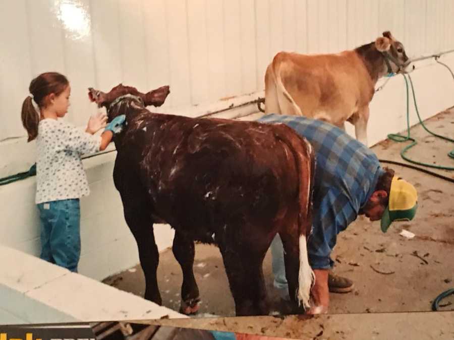 Daughter who paid tribute to farmer father at wedding helps him clean cows