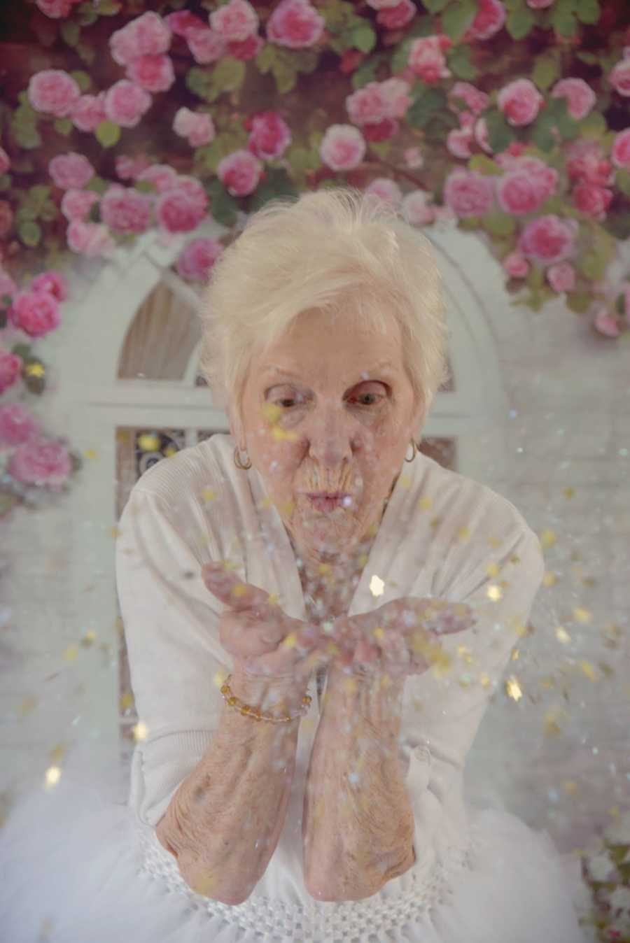 90 year old woman blows sparkles out of her hands