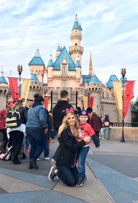 Mother stands with son she gave up for adoption at Disney World