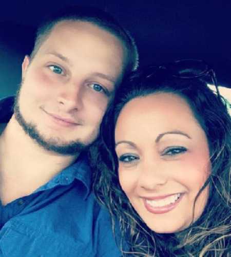 Husband and wife who has infertility issues smile in selfie in car