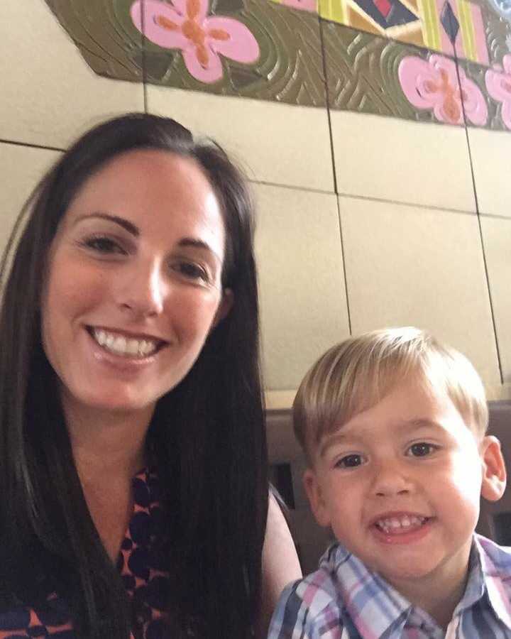 Mother smiles in selfie with her only child who is a toddler boy