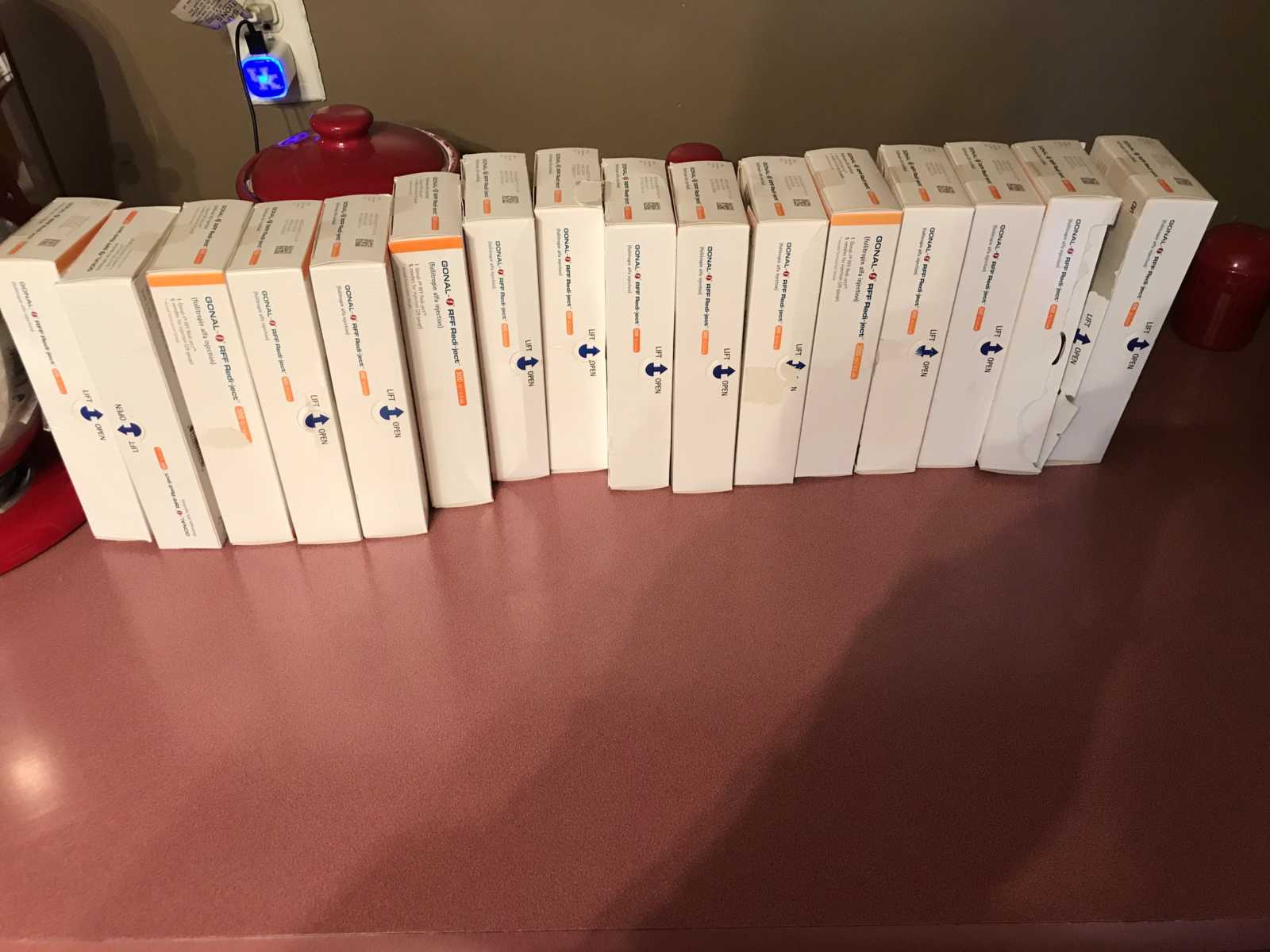 Boxes of IUI shots lined in a row for infertile woman