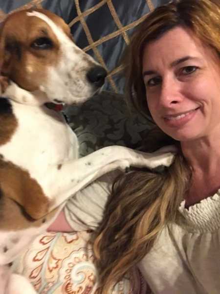 Woman smiles in selfie with her dog that made her get bump on nose checked out