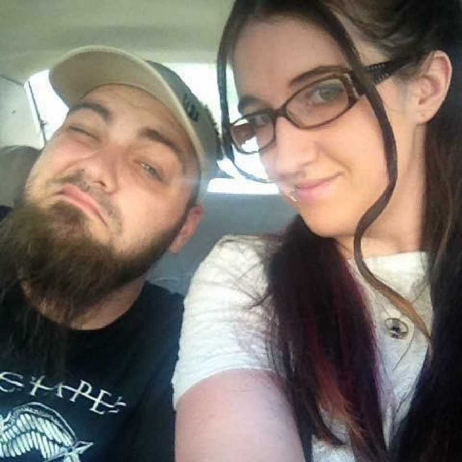 Drug addict teen mom smiles in selfie in car with husband