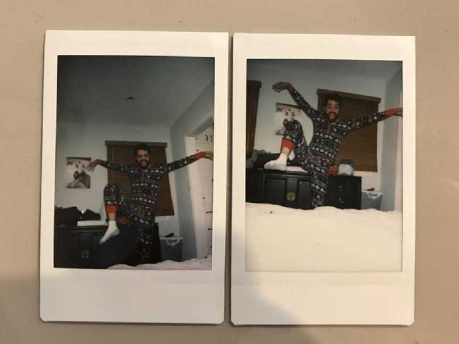 Man in polaroid wearing a onesie posing with arms out and leg raised in air