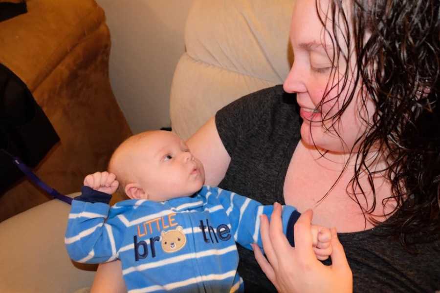 Mother who lost over 100 pounds holds newborn son in her arms