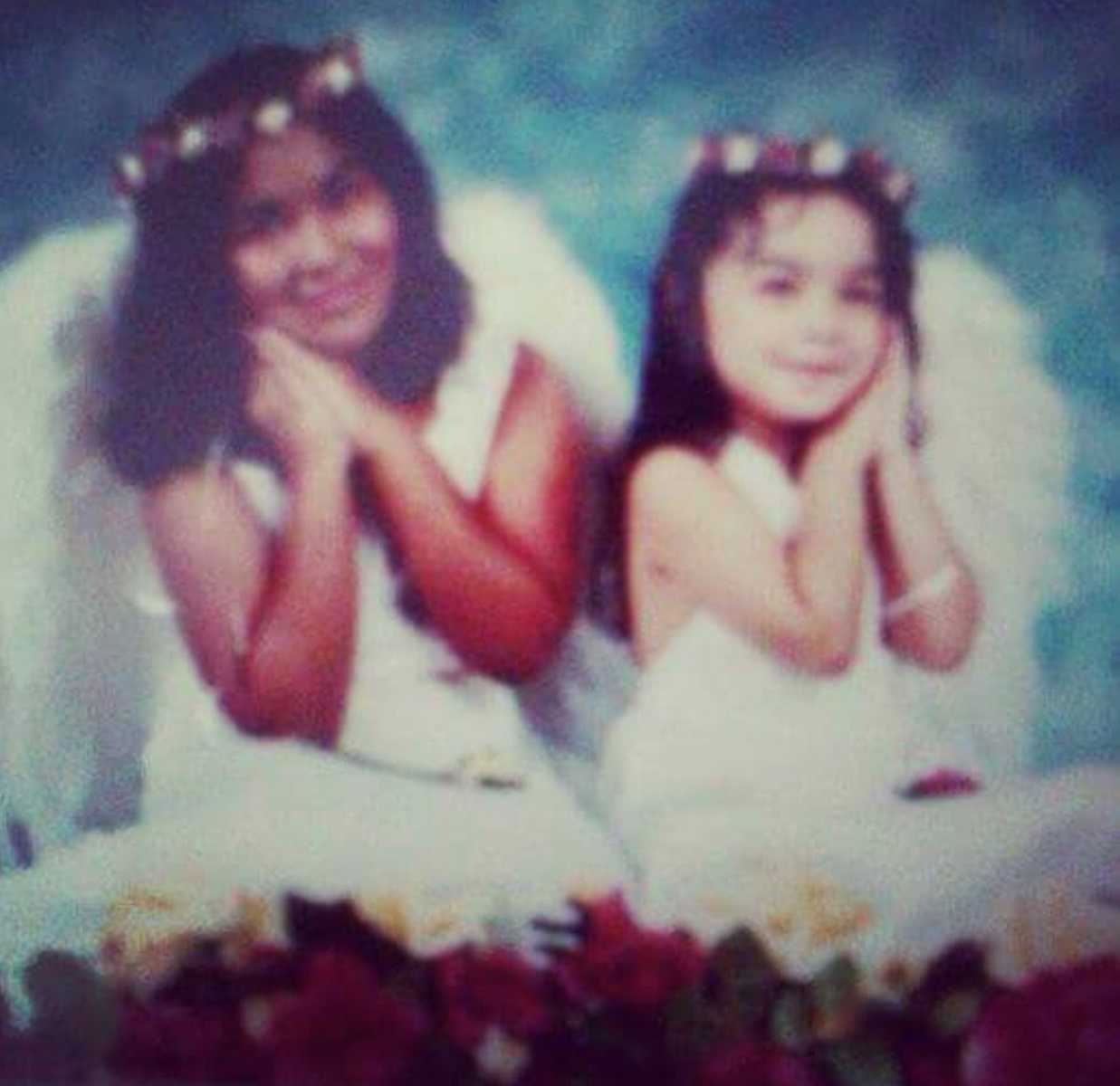 Deceased girl and younger sister pose in angel outfits